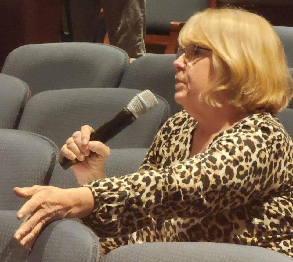 woman holding mic and asking a question